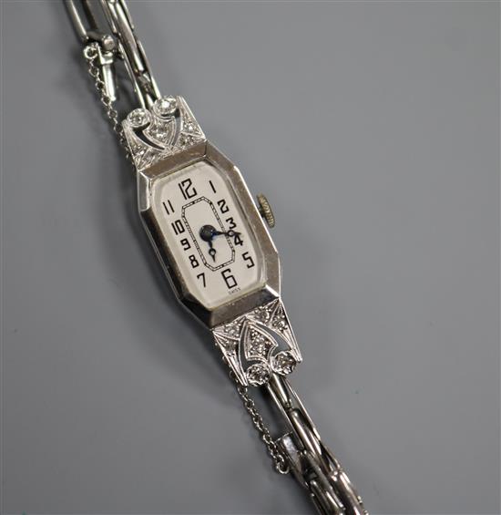 An 18ct white gold and diamond set cocktail watch.